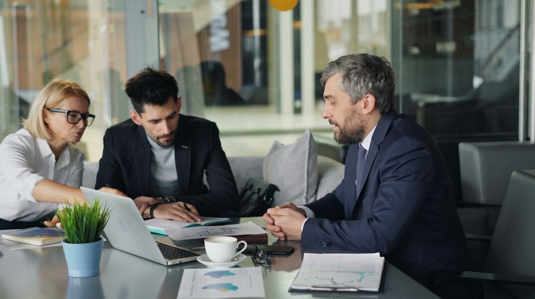 business people negotiating table